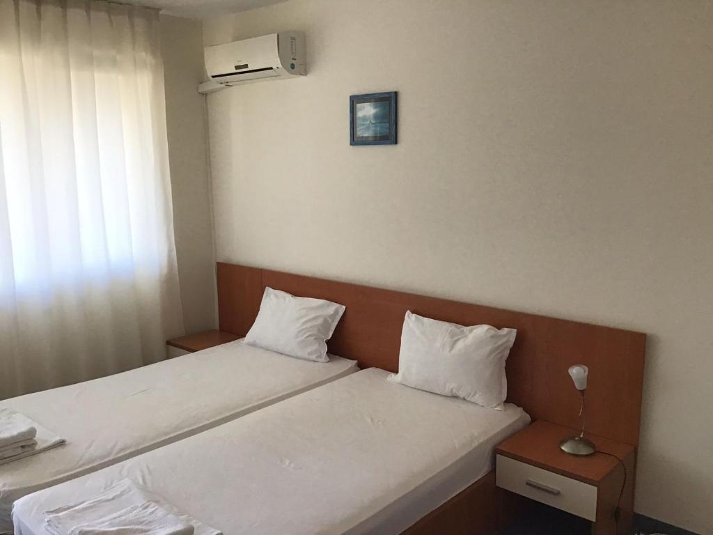 Postel nebo postele na pokoji v ubytování Family Hotel ATLAS
