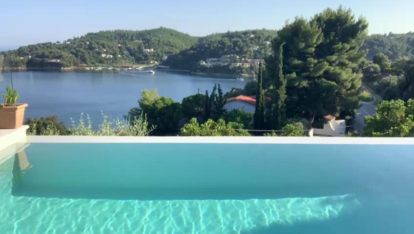 a view of a lake from a swimming pool at Luxury Villa in Sklithri in Skiathos Town