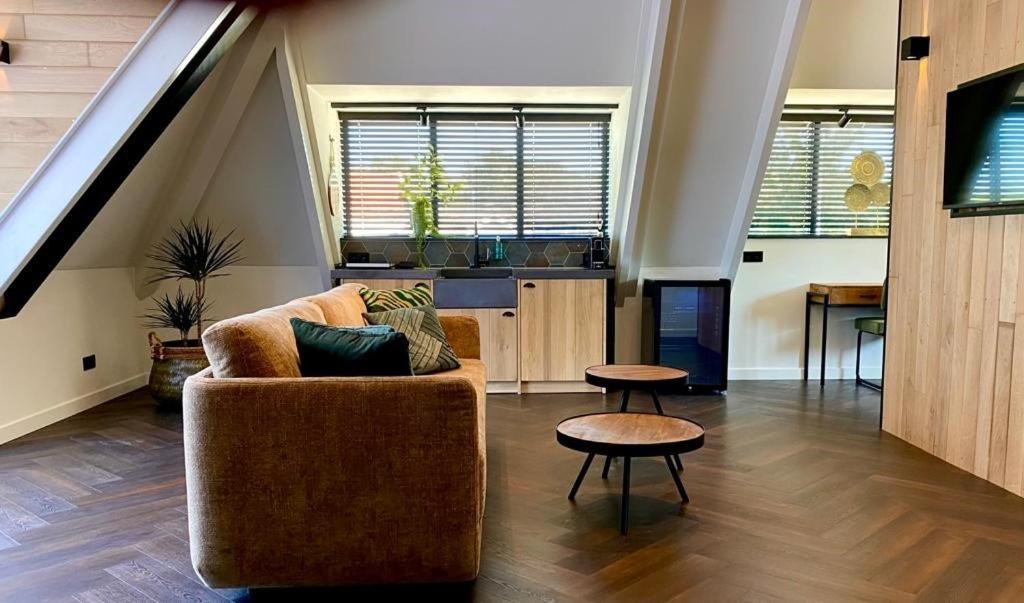 a living room with a couch and a table at Hotel La Boutique in Nijmegen