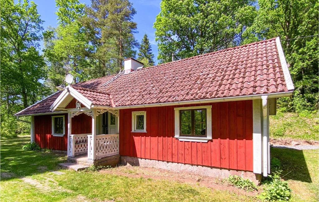 a red tiny house with a red roof at Beautiful Home In Mrdaklev With 3 Bedrooms in Mårdaklev