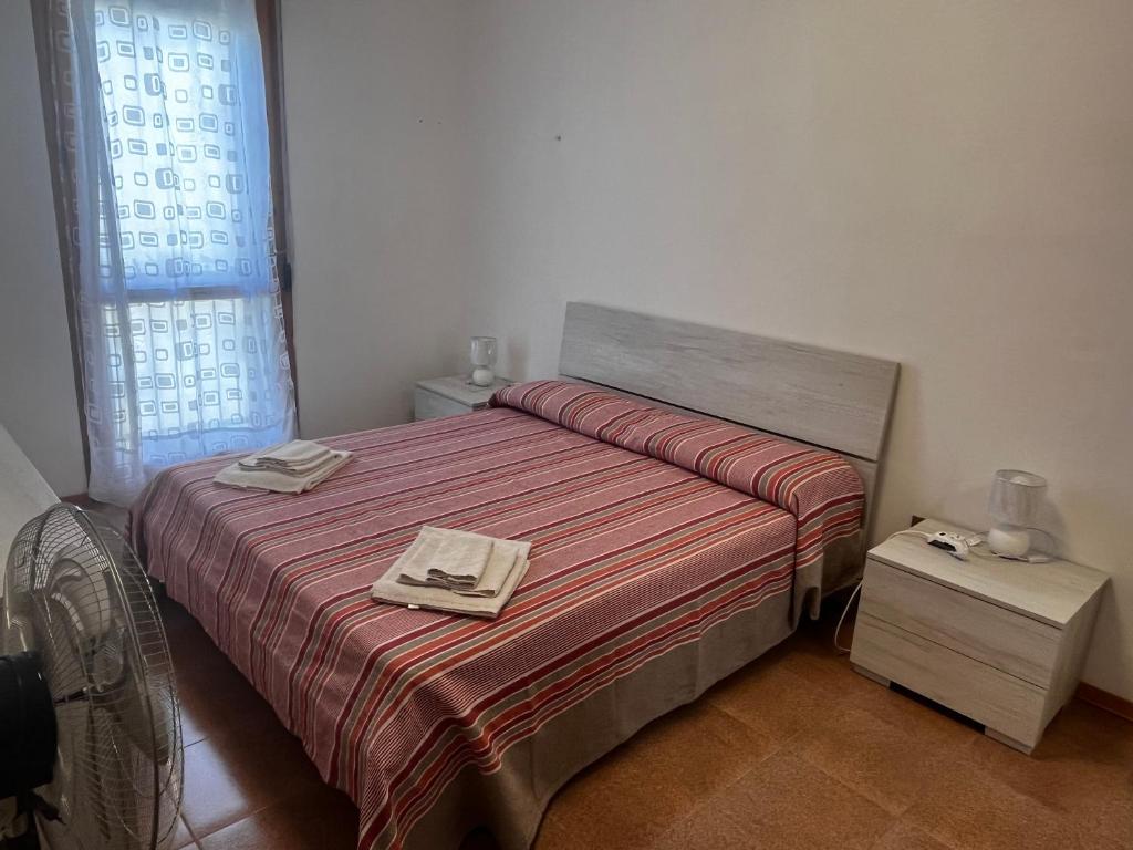 A bed or beds in a room at ALGHERO SUN & SEA - Spiaggia a 50 metri
