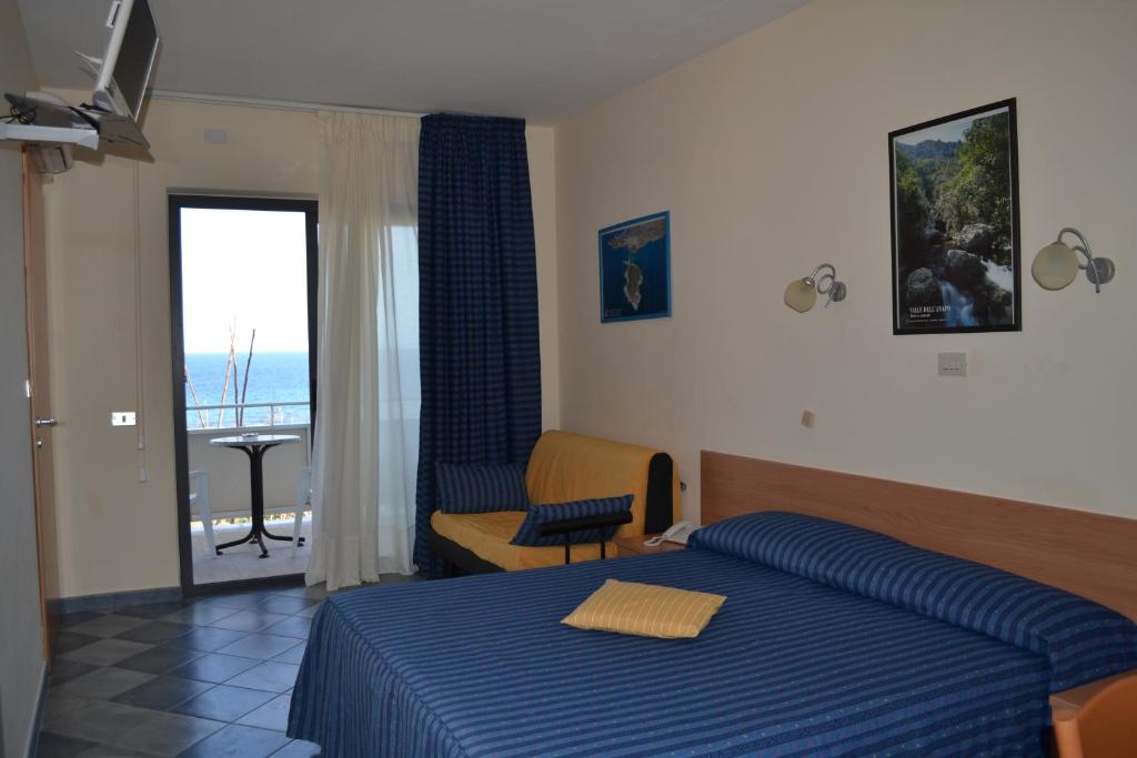 Postel nebo postele na pokoji v ubytování Hotel Jonic