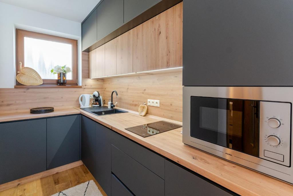 Kuchyň nebo kuchyňský kout v ubytování Apartmány Bobrík