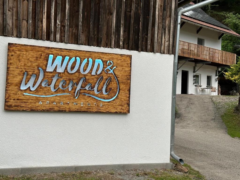 a sign on the side of a building at Wood Apartement in Lambichl