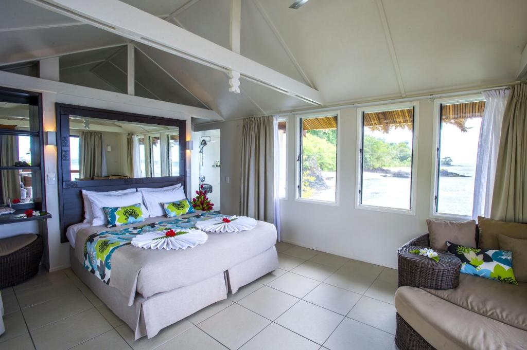 Postel nebo postele na pokoji v ubytování Seabreeze Resort Samoa – Exclusively for Adults