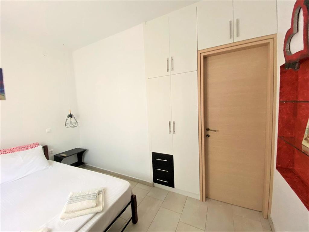 Postel nebo postele na pokoji v ubytování Ionion Seaside Home