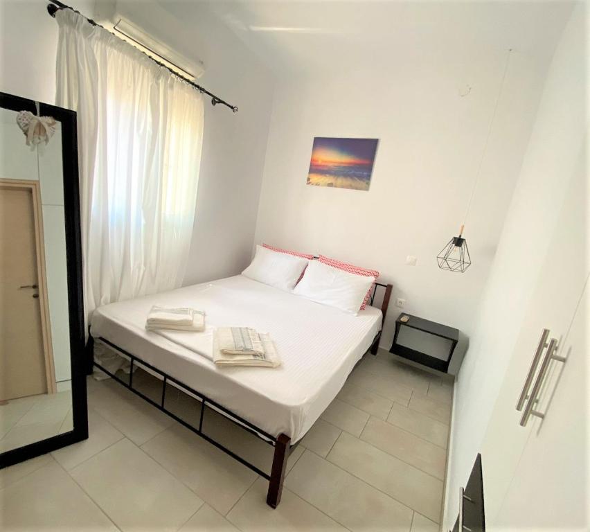 Postel nebo postele na pokoji v ubytování Ionion Seaside Home