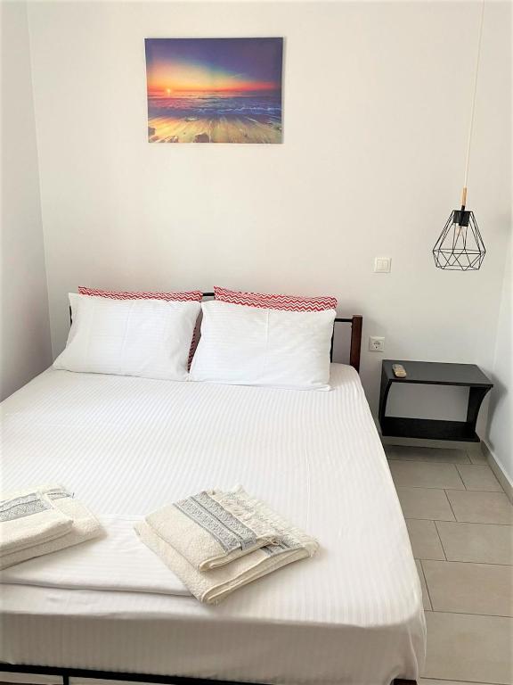 Postel nebo postele na pokoji v ubytování Ionion Seaside Home