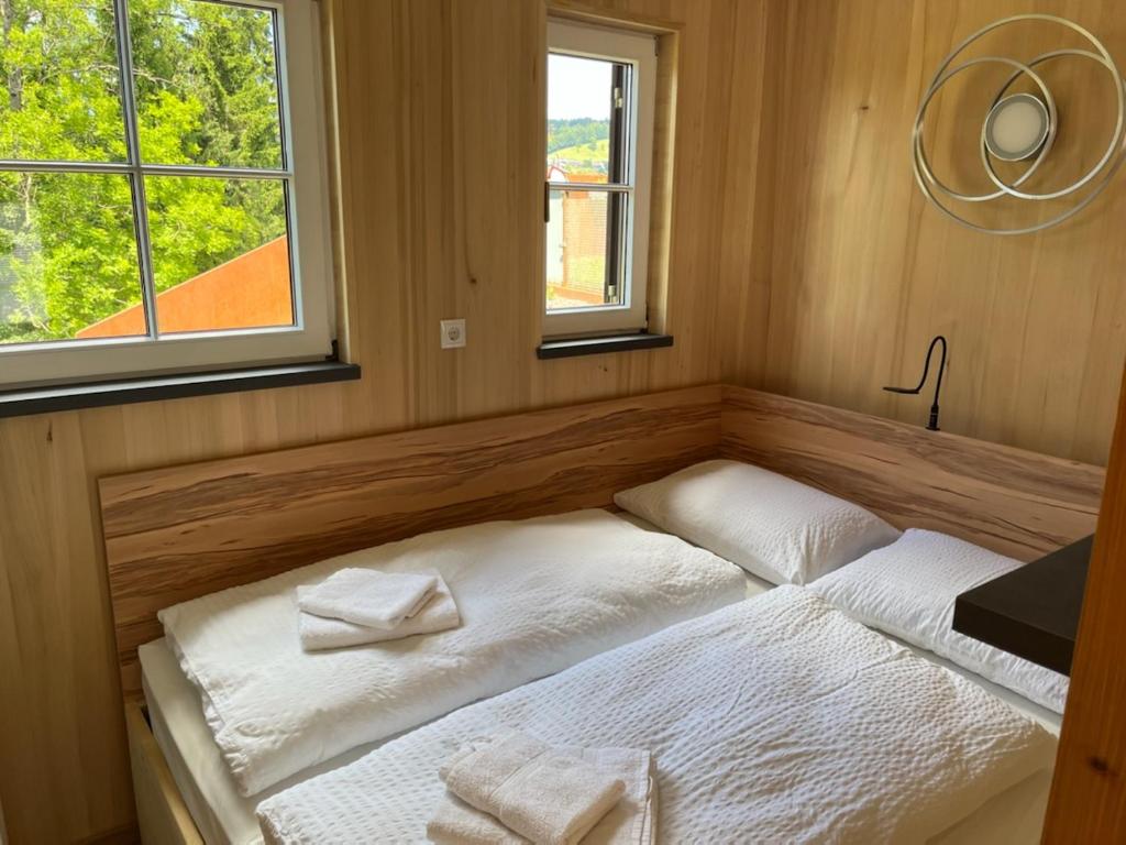 Postel nebo postele na pokoji v ubytování Tiny Haus Dornbirn