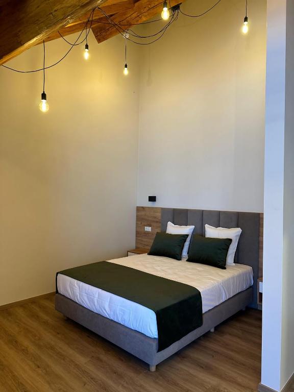a bedroom with a large bed in a room at Hotel Le Postillon in Echternach