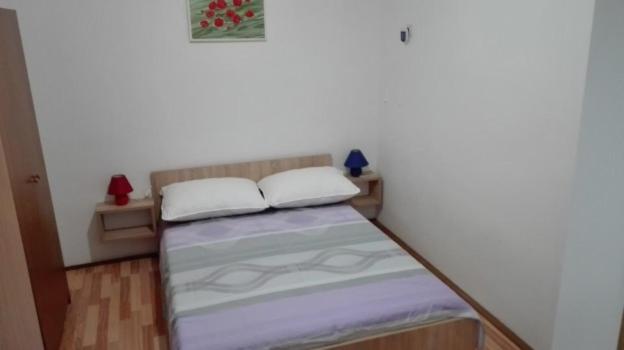 Posteľ alebo postele v izbe v ubytovaní Apartmani Dvosoban