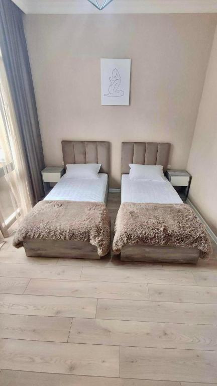 Llit o llits en una habitació de Guest House NIMA
