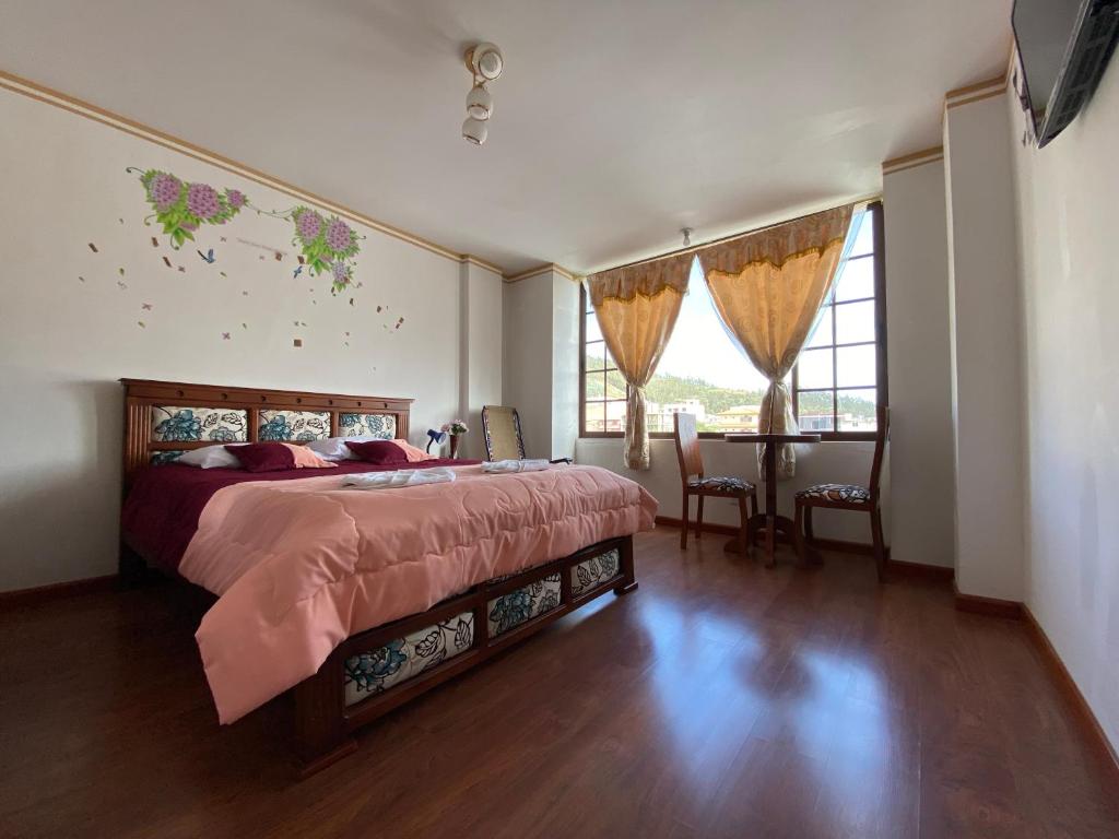 Postel nebo postele na pokoji v ubytování Hostal Arauco