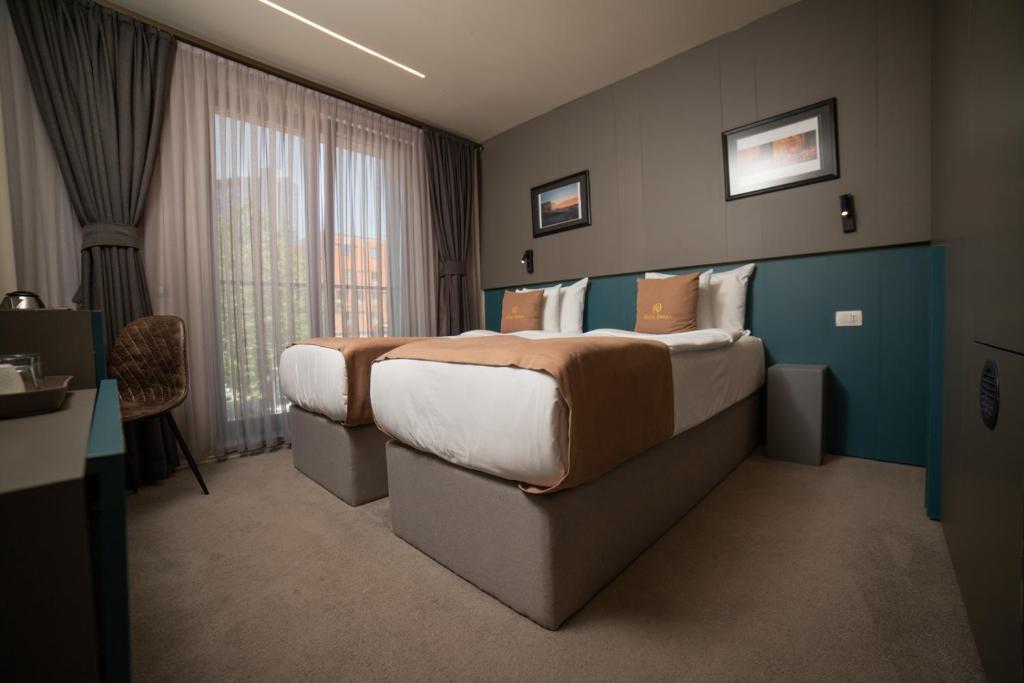 Postel nebo postele na pokoji v ubytování Hotel Opera
