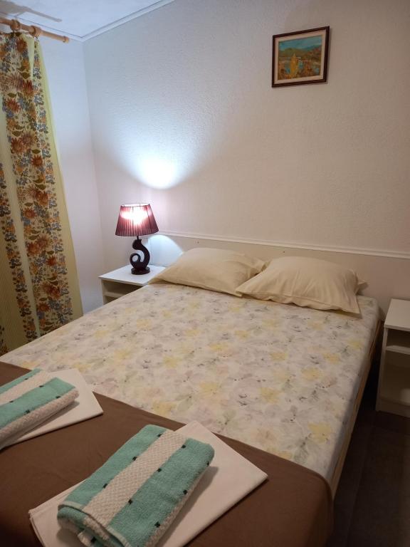Postel nebo postele na pokoji v ubytování Bugenvilija