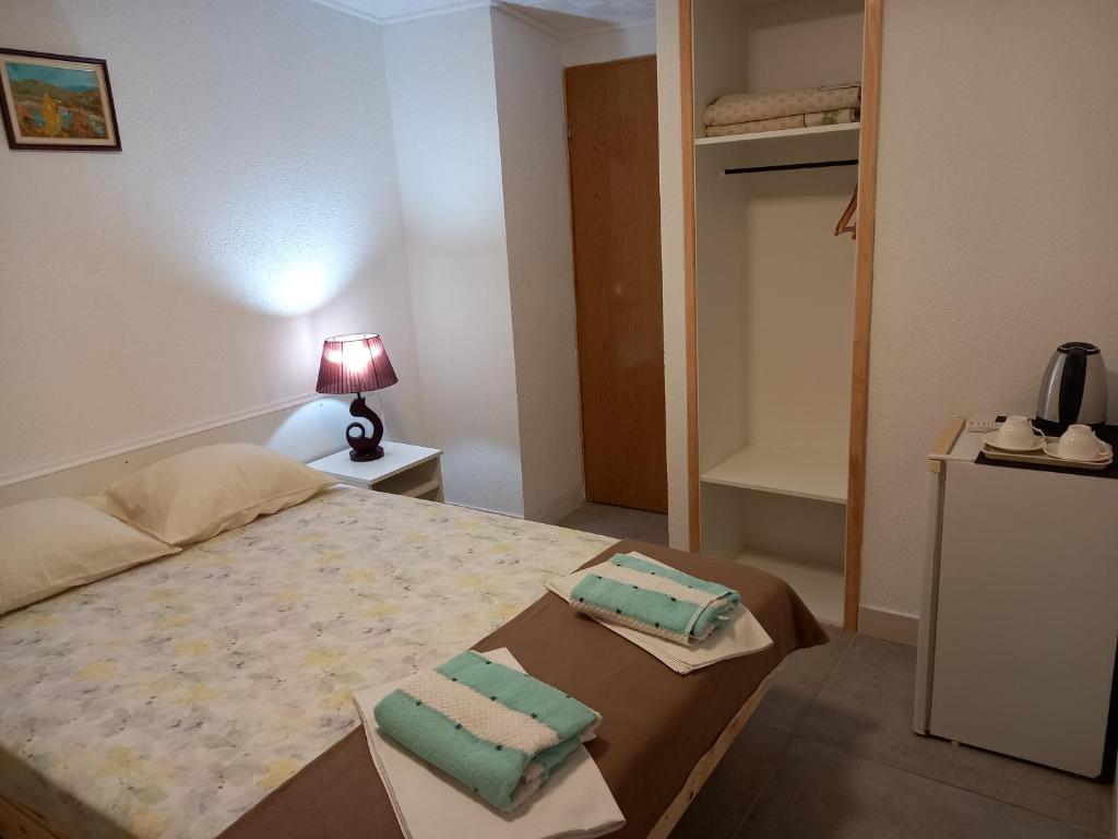 Postel nebo postele na pokoji v ubytování Bugenvilija