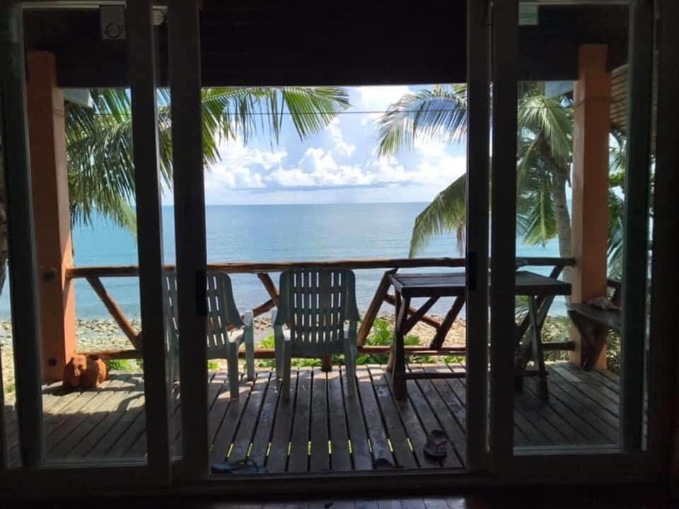 a view of the ocean from the porch of a house at Paradise Palms in Ko Chang