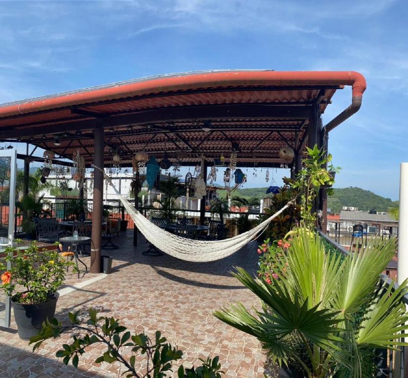 a hammock in a pavilion on a patio at Grann Posada Xilitla in Xilitla