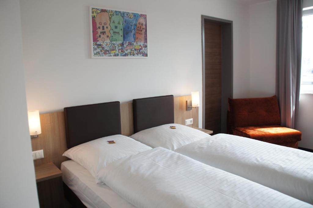 Postel nebo postele na pokoji v ubytování Euro Hotel Friedberg