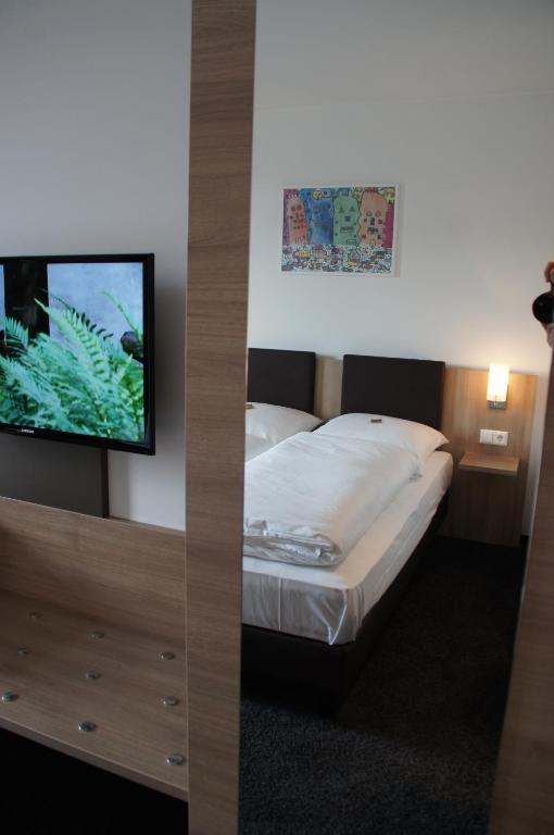 Postel nebo postele na pokoji v ubytování Euro Hotel Friedberg