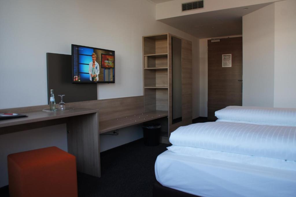 Postel nebo postele na pokoji v ubytování Euro Hotel Friedberg