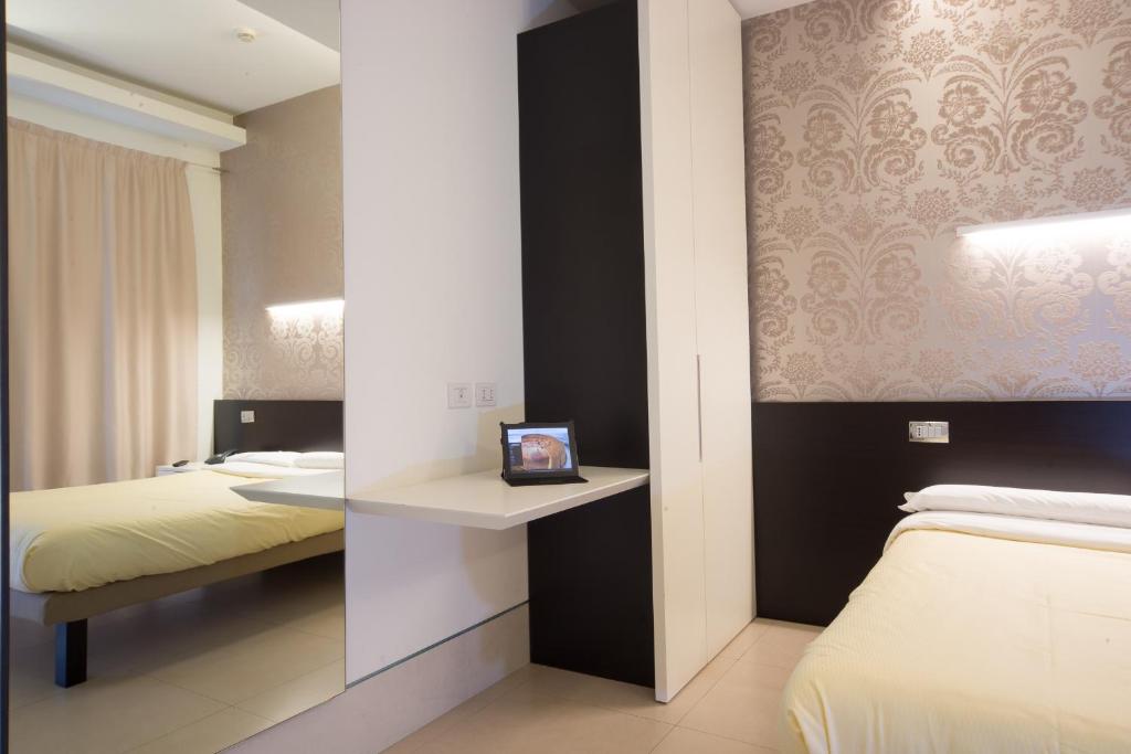 Postel nebo postele na pokoji v ubytování Savoy Hotel