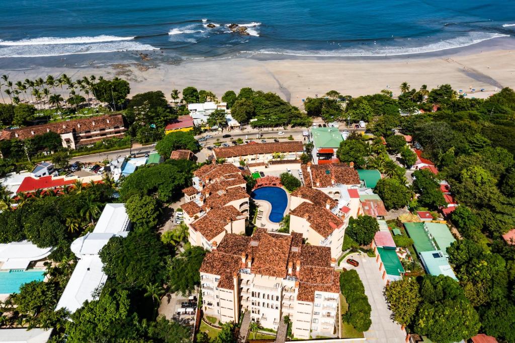 an aerial view of a beach with houses and the ocean at Villa Hibiscus in Tamarindo