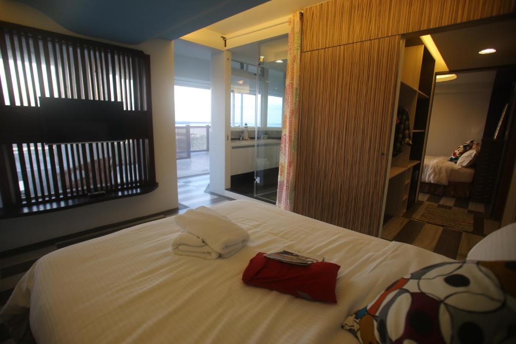 Un pat sau paturi &icirc;ntr-o camer&#x103; la Malibu OceanView Homestay