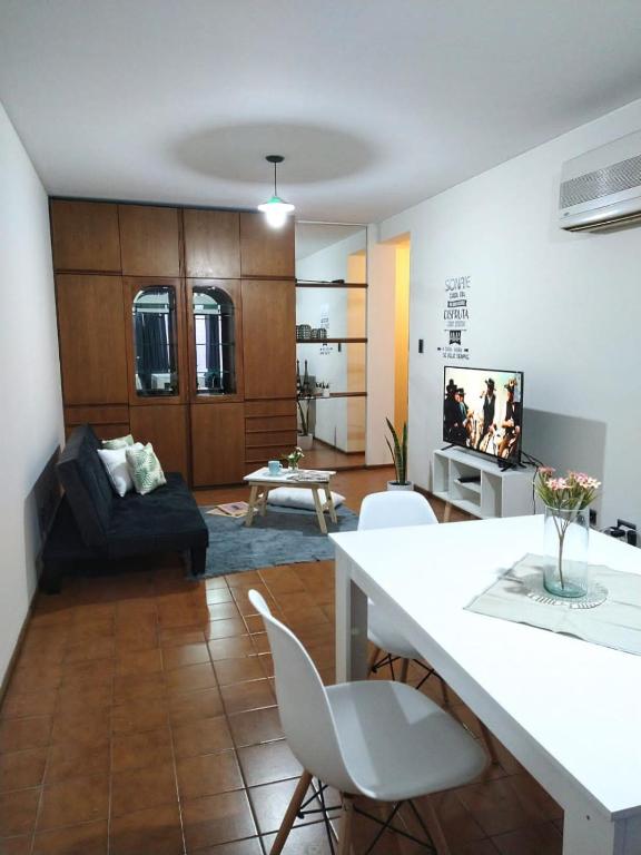 a living room with a couch and a table at Departamento Céntrico Ciudad Mendoza Belgrano y Aristides con cochera in Mendoza