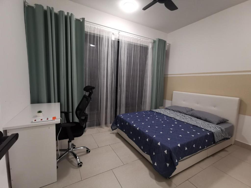 a bedroom with a bed and a desk and a window at Astetica 3 Bedrooms in Seri Kembangan