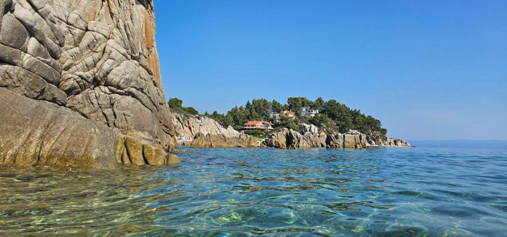 a small island in the middle of the water at Niki House in Agios Nikolaos