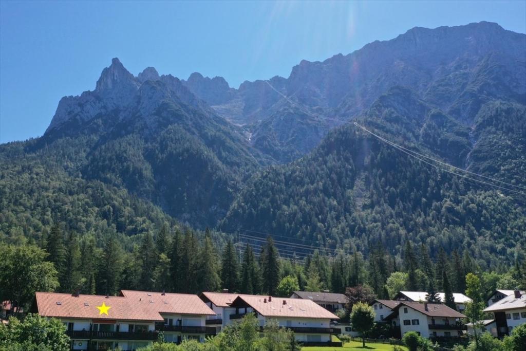 a kite flying in front of a mountain at Appartement Raineck in Mittenwald