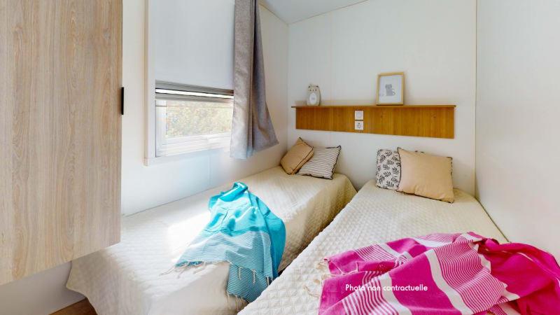 Postel nebo postele na pokoji v ubytování Camping Officiel Siblu Les Oyats