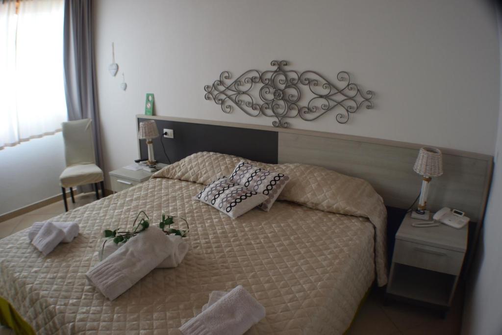 Postel nebo postele na pokoji v ubytování Residenza Al Castello