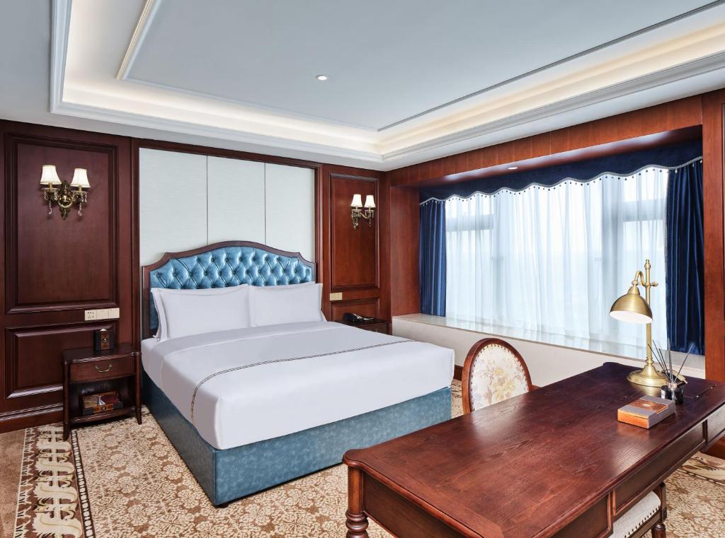 Postel nebo postele na pokoji v ubytování Guangming CIMC Executive Hotel Shenzhen