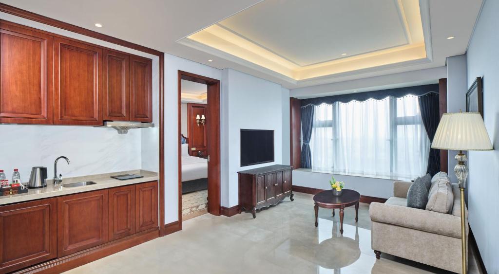 TV a/nebo společenská místnost v ubytování Guangming CIMC Executive Hotel Shenzhen