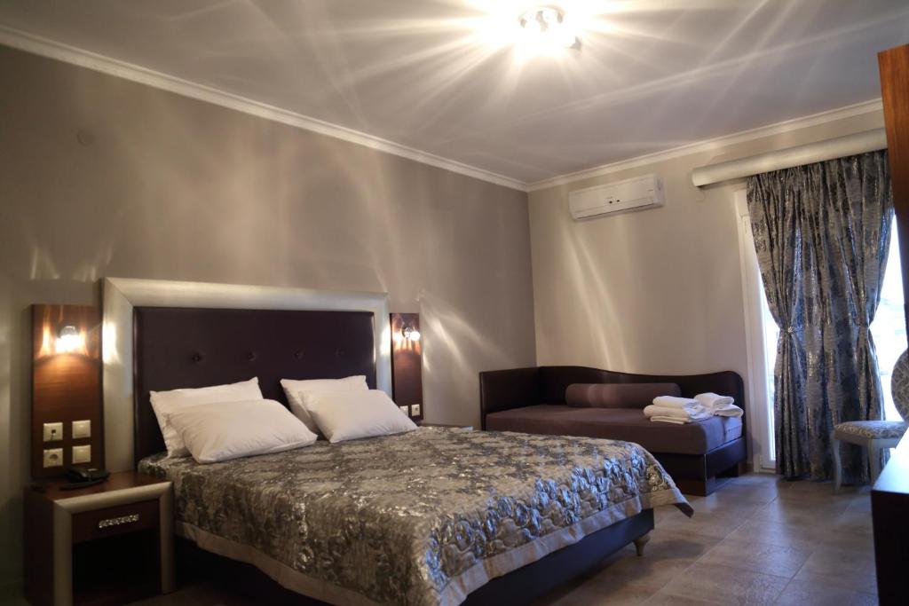 Postel nebo postele na pokoji v ubytování Hotel Souita