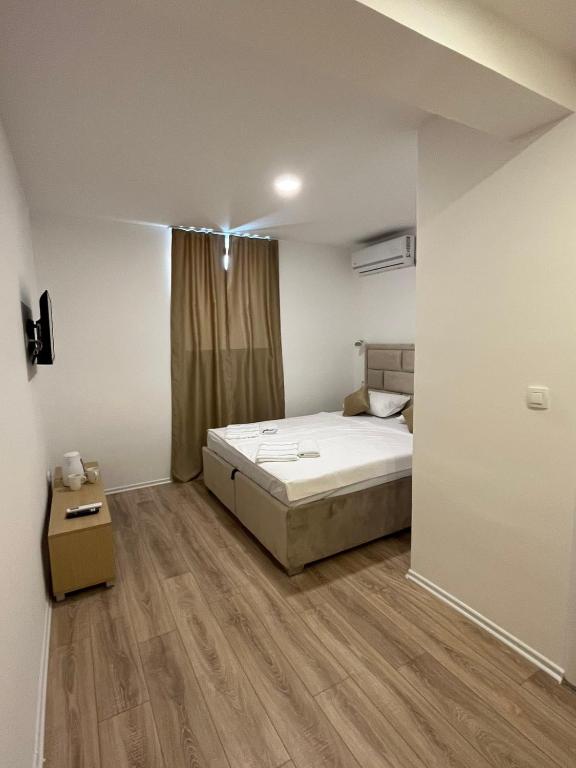 Postel nebo postele na pokoji v ubytování Apartments Ejla&Una