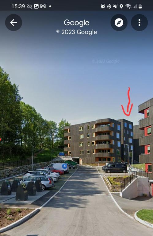 a picture of a street with cars parked in a parking lot at 7,3sq mts room -Forests cozy house in Stavanger