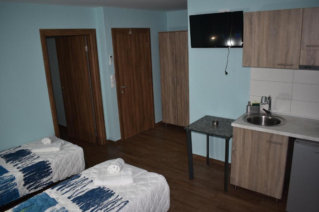 Postel nebo postele na pokoji v ubytování Villa Olympia