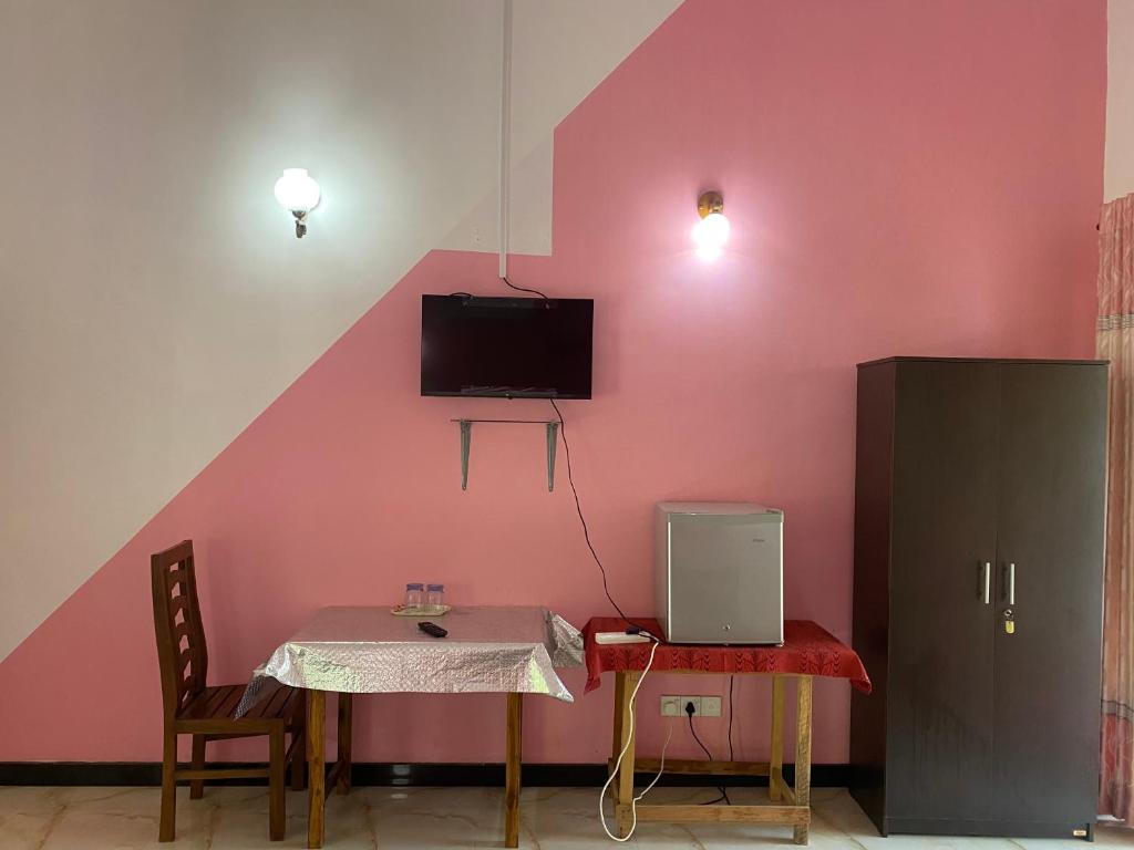 TV a/nebo společenská místnost v ubytování Island Breeze Inn