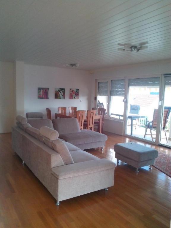 a living room with two couches and a table at Madunić in Podstrana