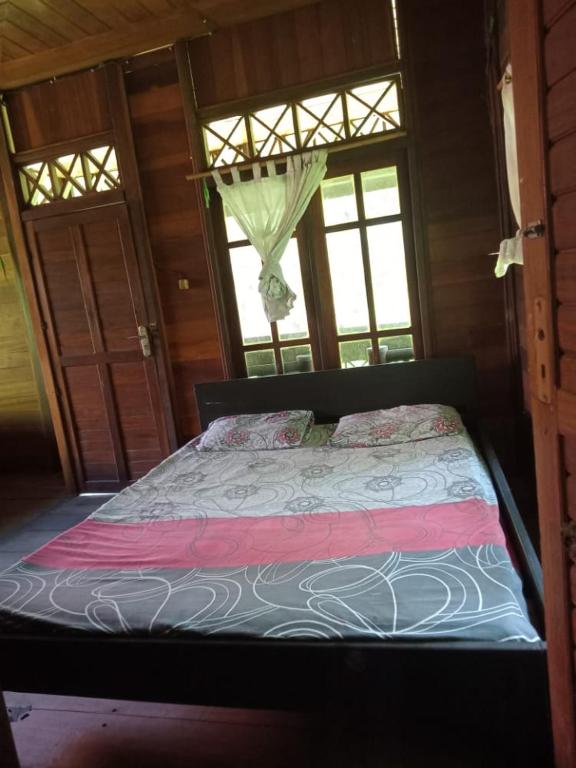 Postel nebo postele na pokoji v ubytování Lorenso Cottage