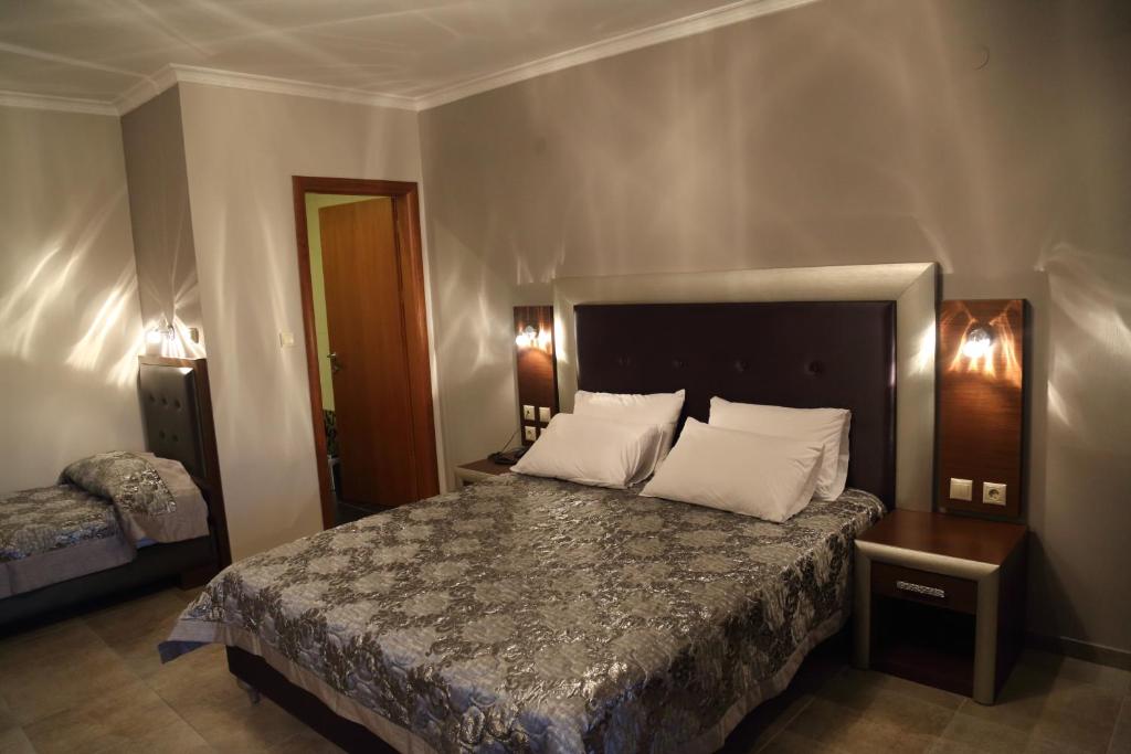 Postel nebo postele na pokoji v ubytování Hotel Souita