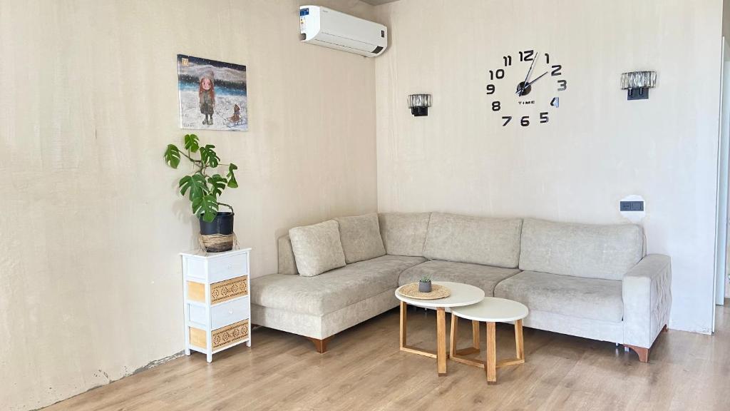 a living room with a couch and a table at temuka in Samgori