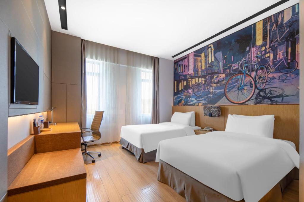 Postel nebo postele na pokoji v ubytování Minimax Hotel Shanghai Songjiang