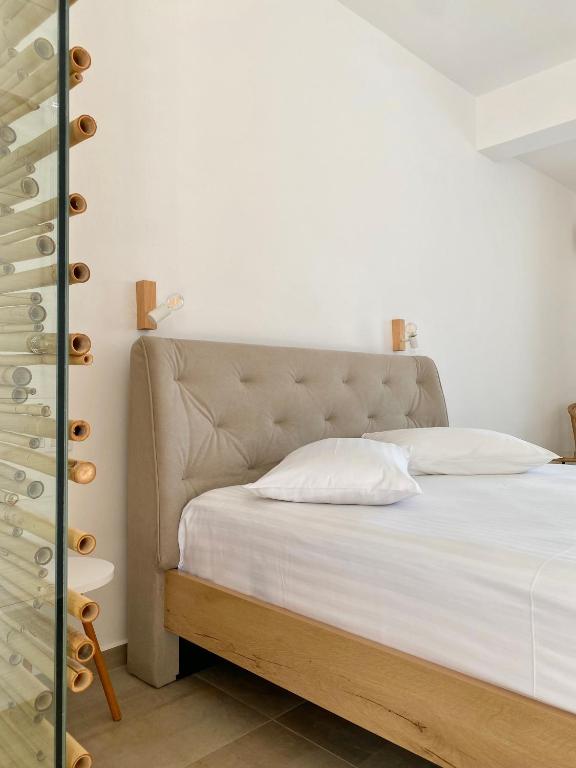 Postel nebo postele na pokoji v ubytování Fikas Hotel