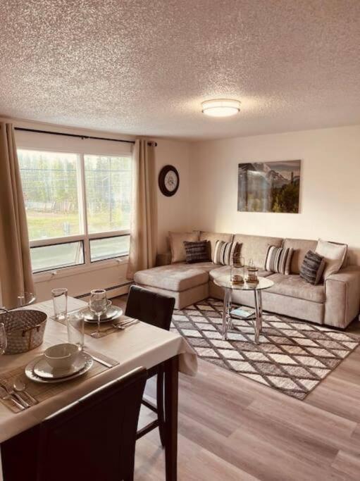 a living room with a couch and a table at North Star Place Apt 12 (premium) in Fairbanks