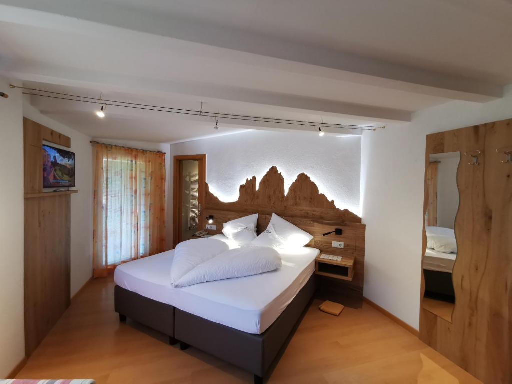 Postel nebo postele na pokoji v ubytování Hotel Akelei