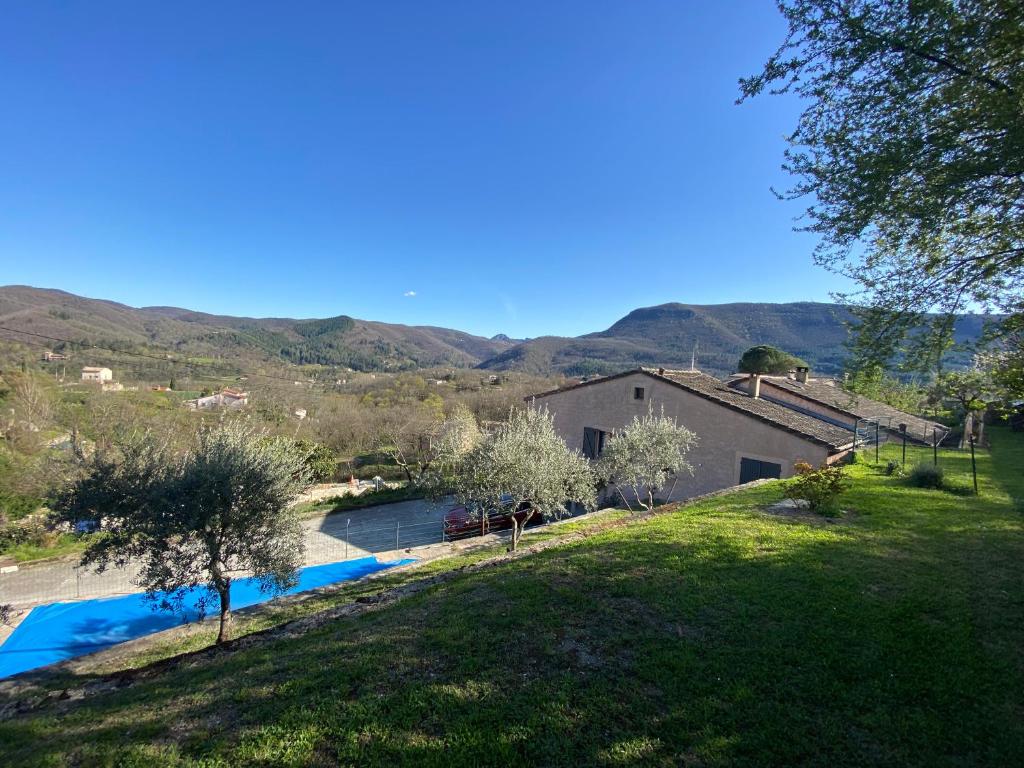 a view of a house and a swimming pool at La paresse in Avèze